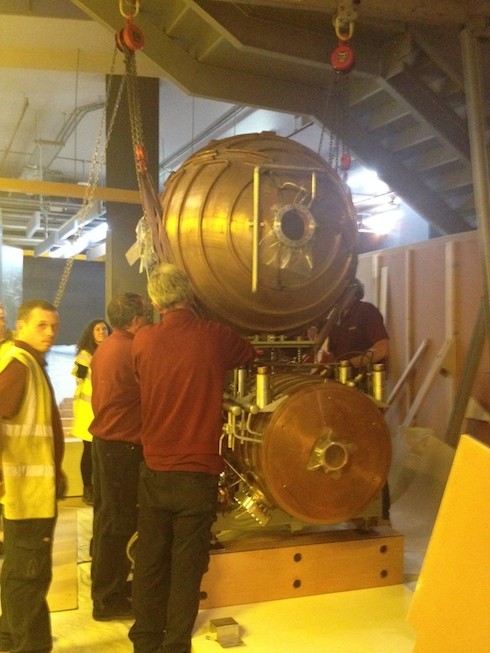 The LEP cavity's storage sphere is carefully lowered into place. (Credit: Alison Boyle)
