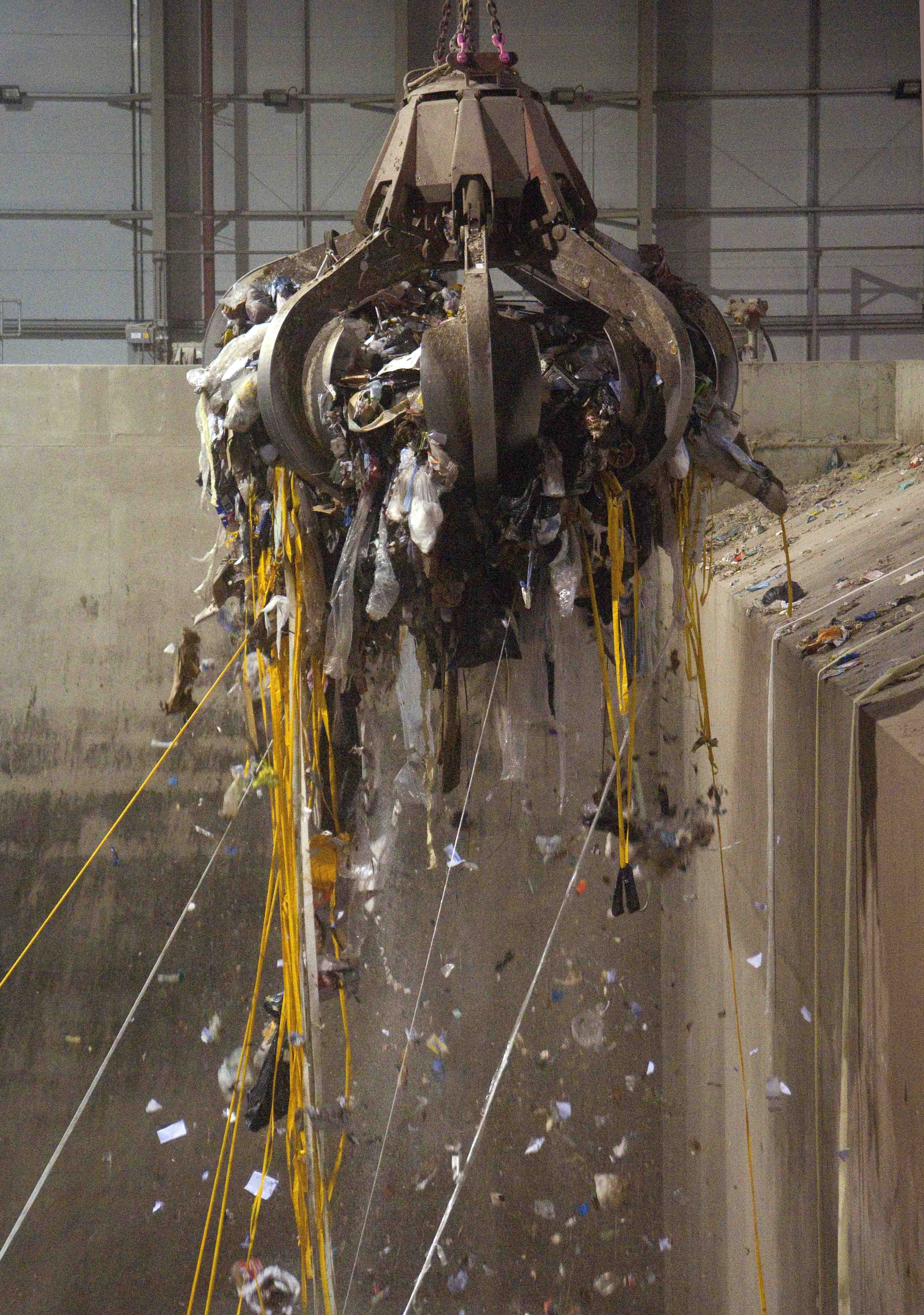 A giant claw lifting general waste into the incinerator at the Energy from Waste plant © Science Museum