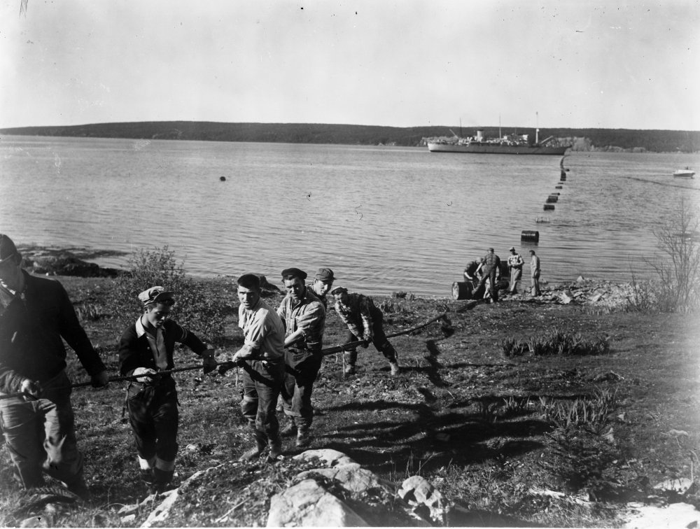 Cable operations at Clarenville, Newfoundland, preparing to bring cable ashore, 1955. Image credit: Courtesy of BT Heritage & Archives