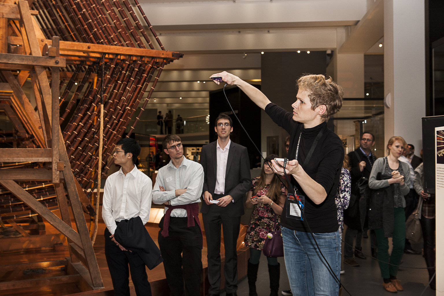 Visitors watch a musical performance of Rafael Lozano-Hemmer's Fiducial Voice Beacons artwork. Image credit: Science Museum