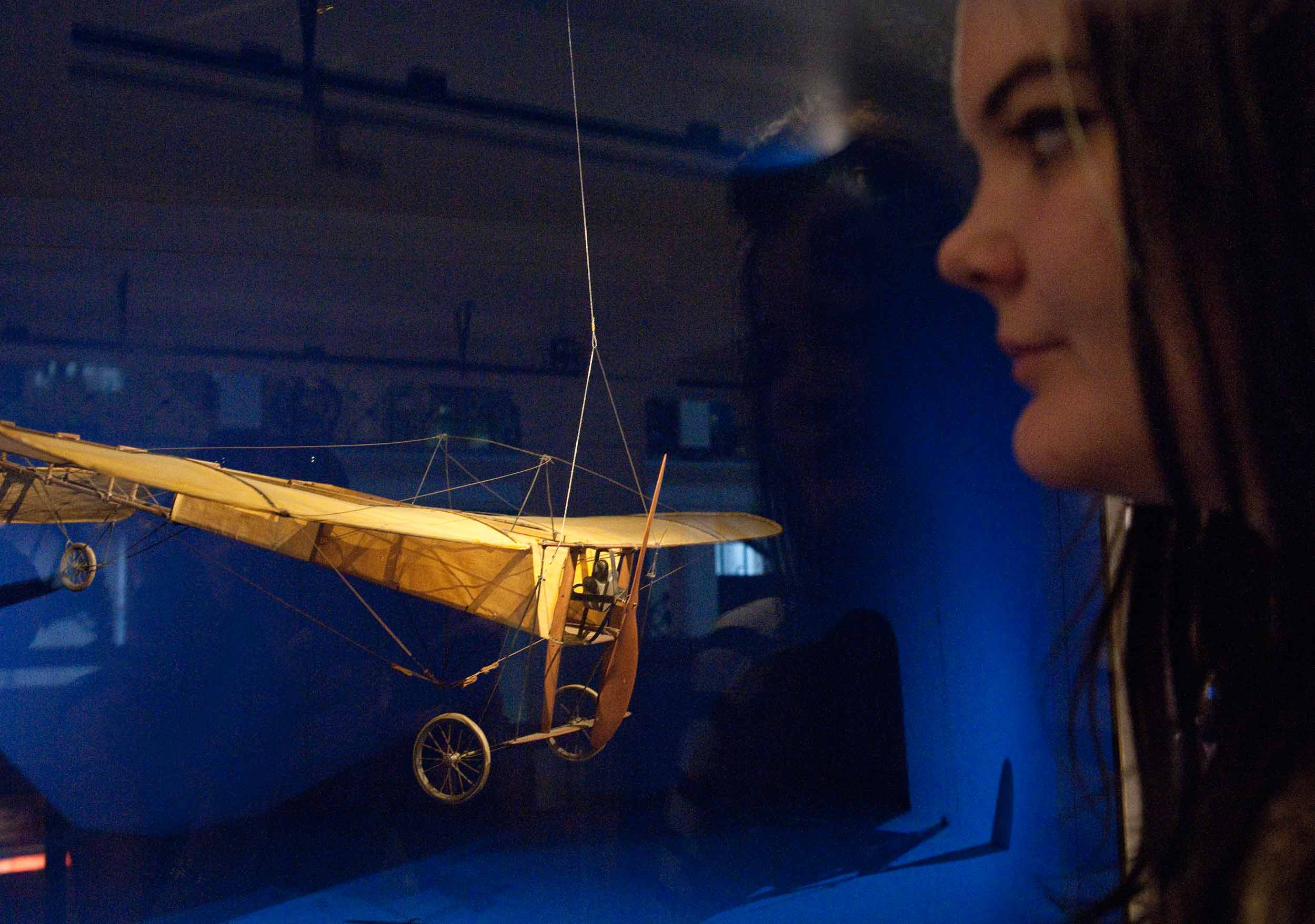 A guest peers at a model Bleriot plane in the exhibition. Image credit: Science Museum