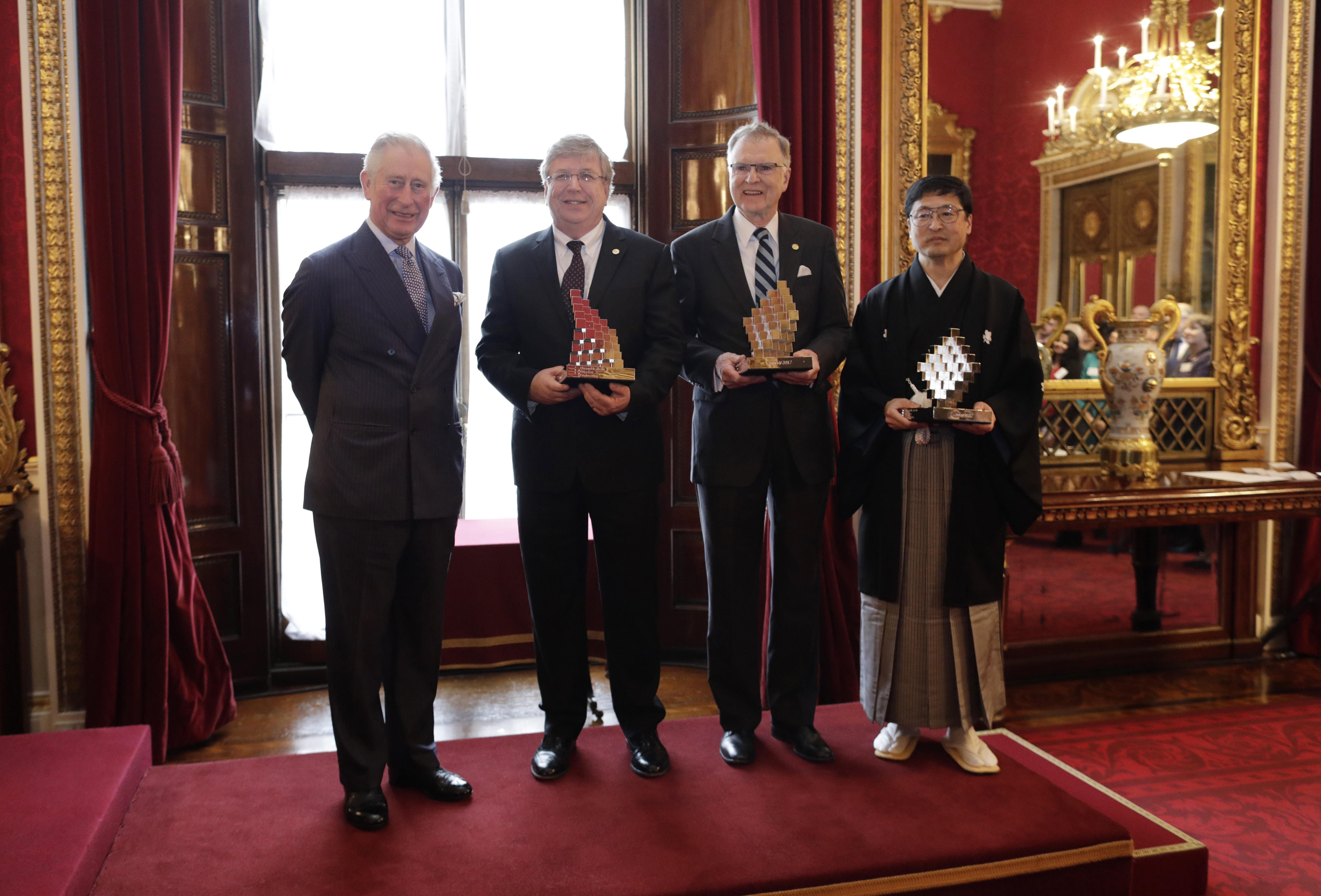 HRH The Prince of Wales (left) with QE Prize winners Eric Fossum, Michael Tompsett and Nobukazu Teranishi. 