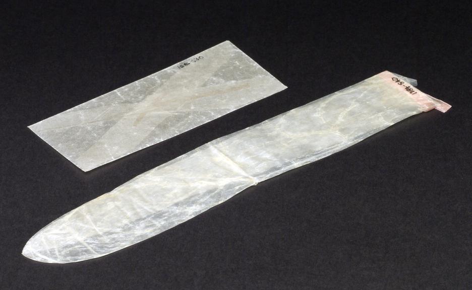 Contraceptive sheath, made from animal gut, in waxed paper envelope