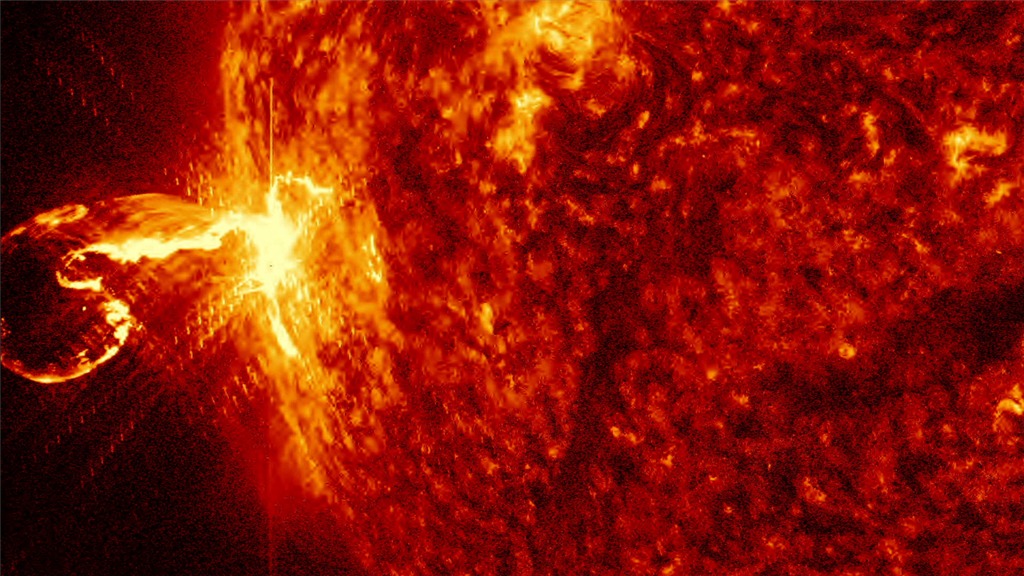 A solar flare and accompanying coronal mass ejection blasting off from the surface of the Sun. Image: NASA's Goddard Space Flight Center