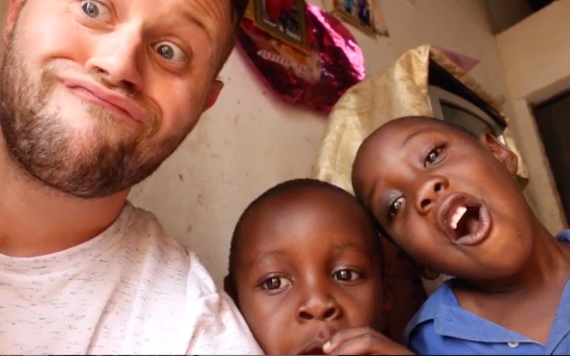 Luke on a visit to Uganda, meeting two boys with haemophilia Credit: Luke Pembroke