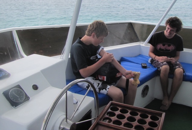 Luke, aged 15 year old, injecting factor on a boat on a holiday to the Galapagos Credit: Luke Pembroke