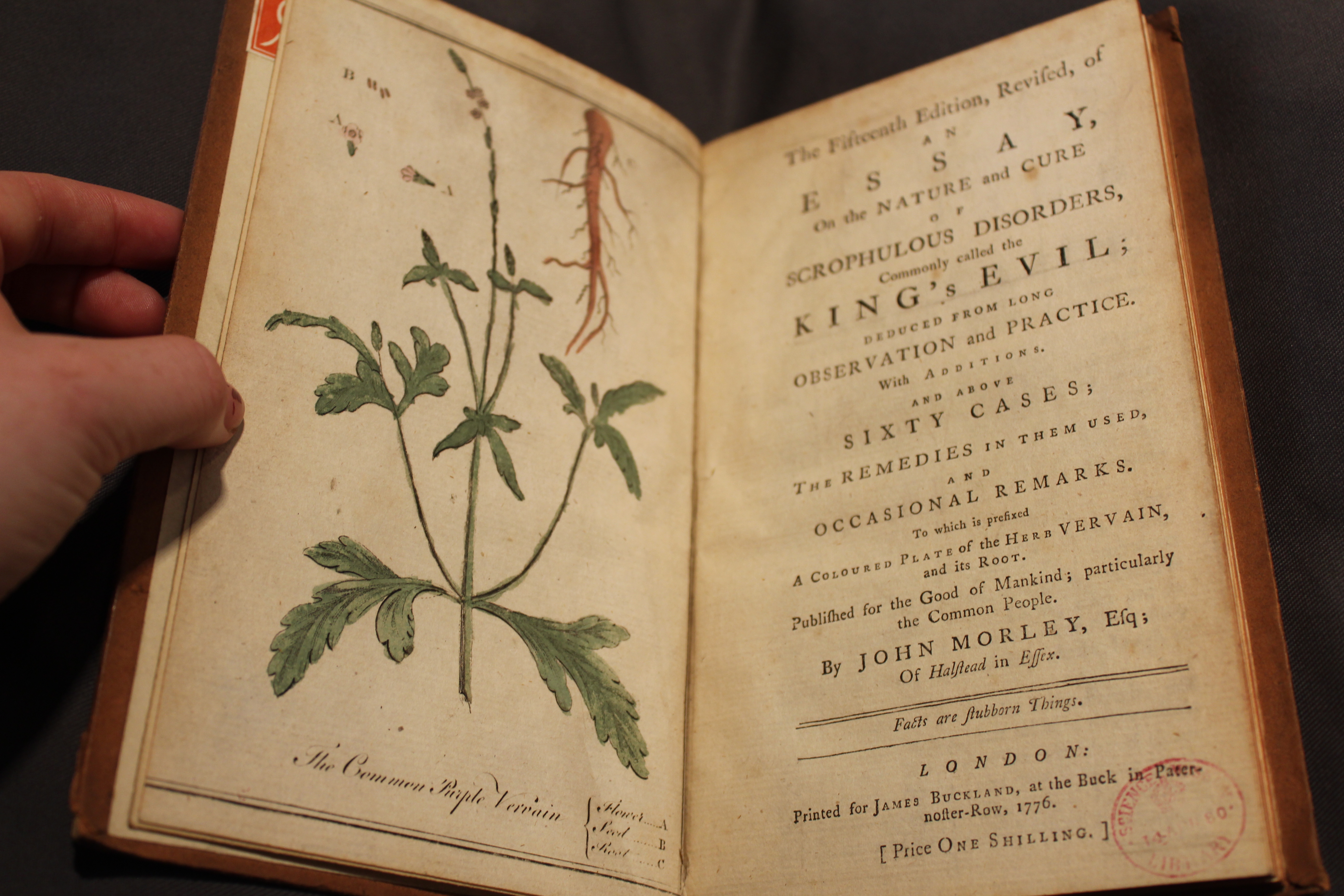 John Morley, The fifteenth edition, revised, of an essay, on the nature and cure of scrophulous disorders, commonly called the king's evil. London, 1776. Open at the title page and an inserted plate of the herb vervain.