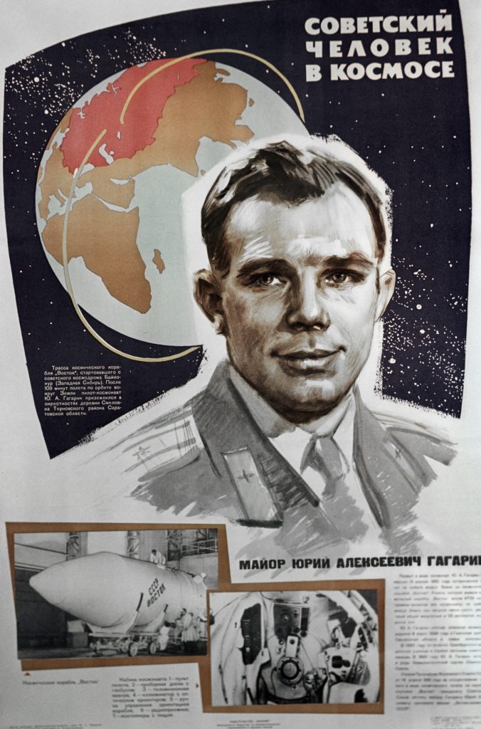 Article from a Soviet magazine on Yuri Gagarin's mission with a lifelike illustration of the astronaut in front of a graphic of the Earth. The article also features black and white photographs of the space shuttle interior and exterior.