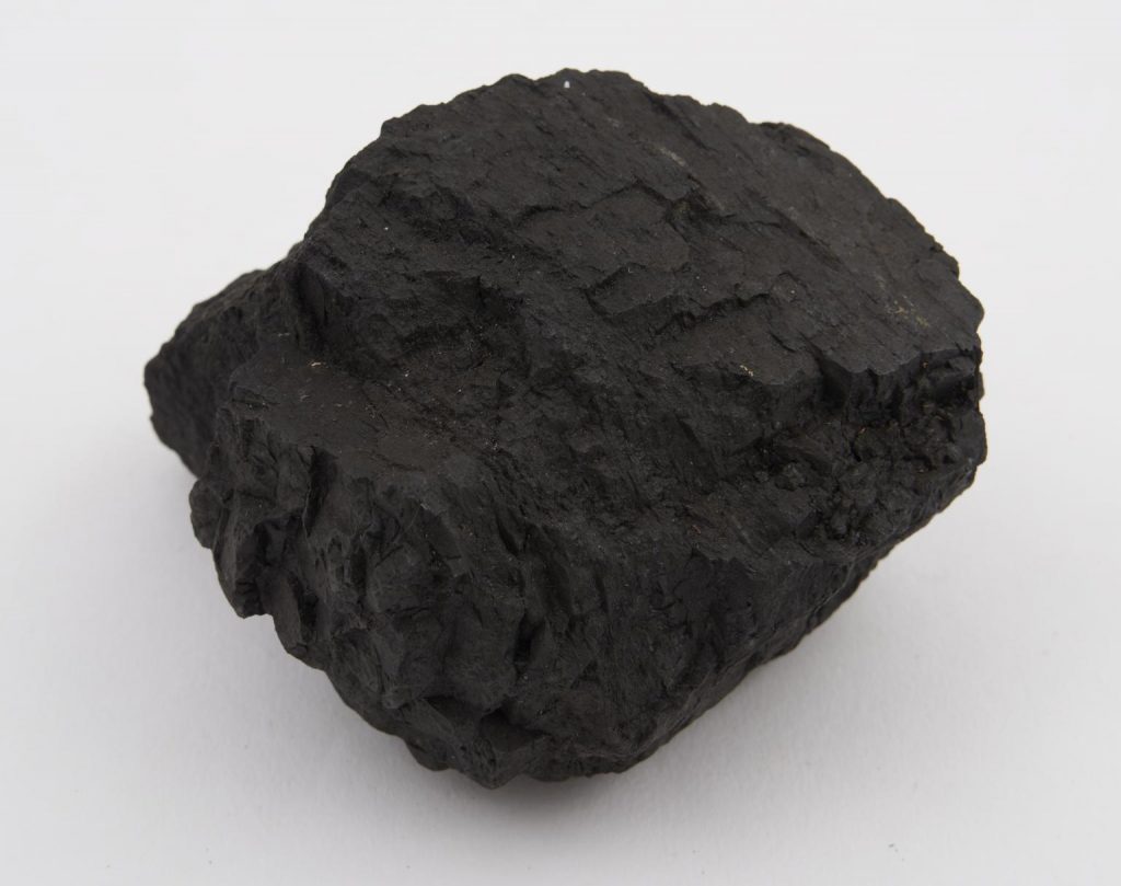 Piece of coal on a white background.