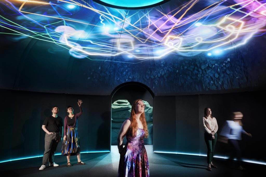Visitors inside the Off-World section of the Science Fiction Voyage to the Edge of Imagination