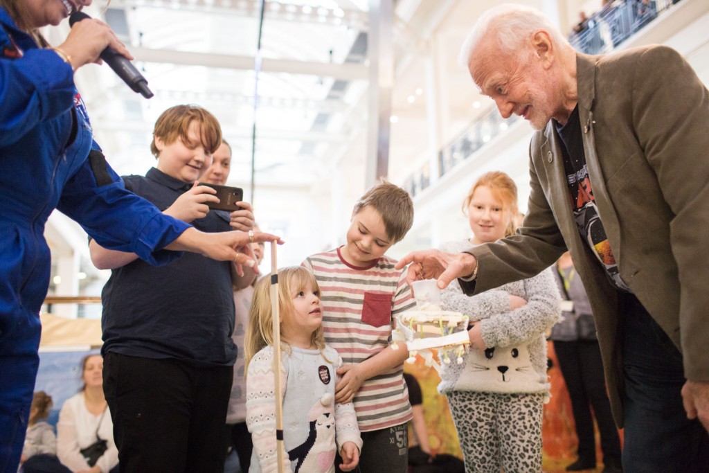 Buzz Aldrin helps children test their Mars Rovers at the Science Museum. credit Benjamin Ealovega, Science Museum