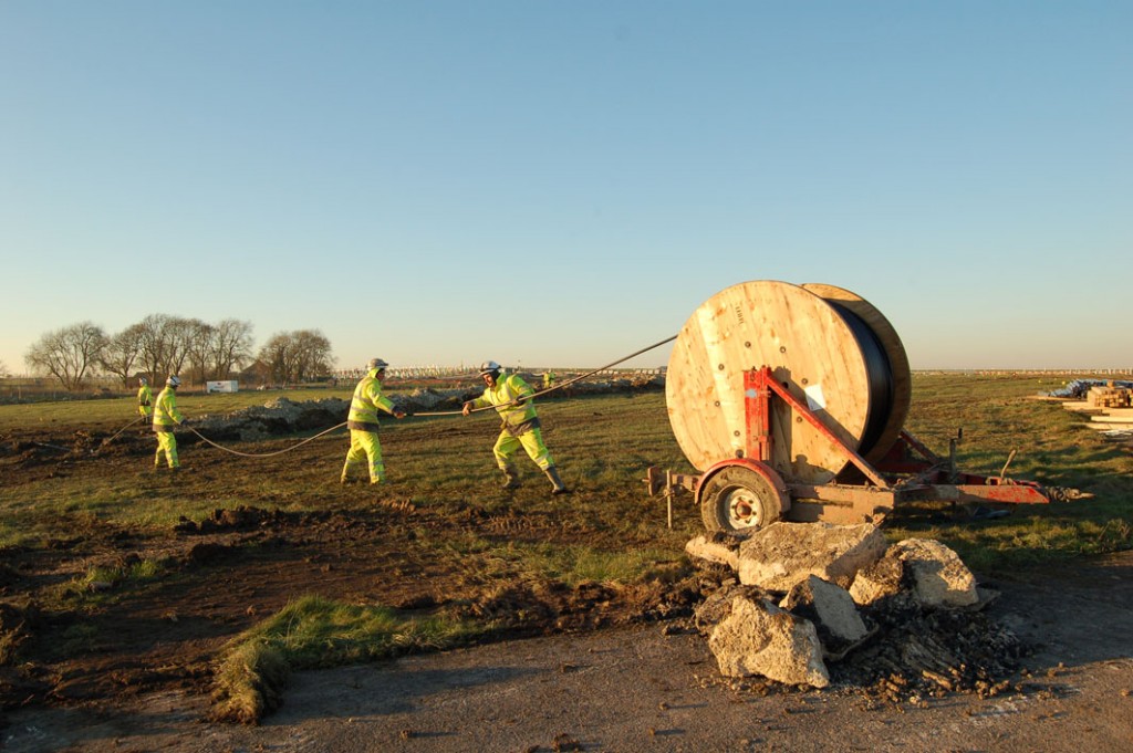 Pulling cables into the trenches