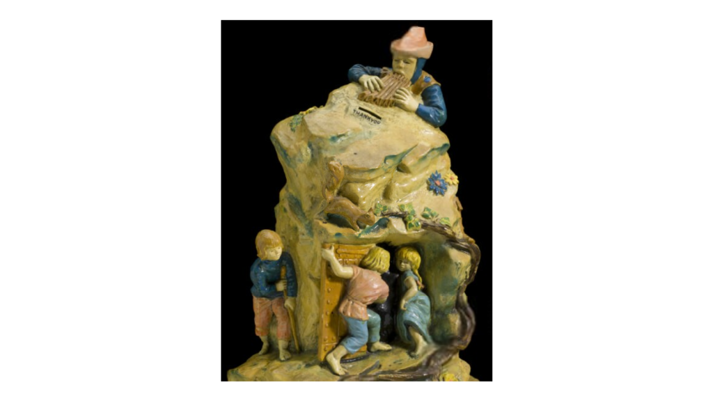Collecting box by Action Research depicting the Pied Piper of Hamlin, 1950s.