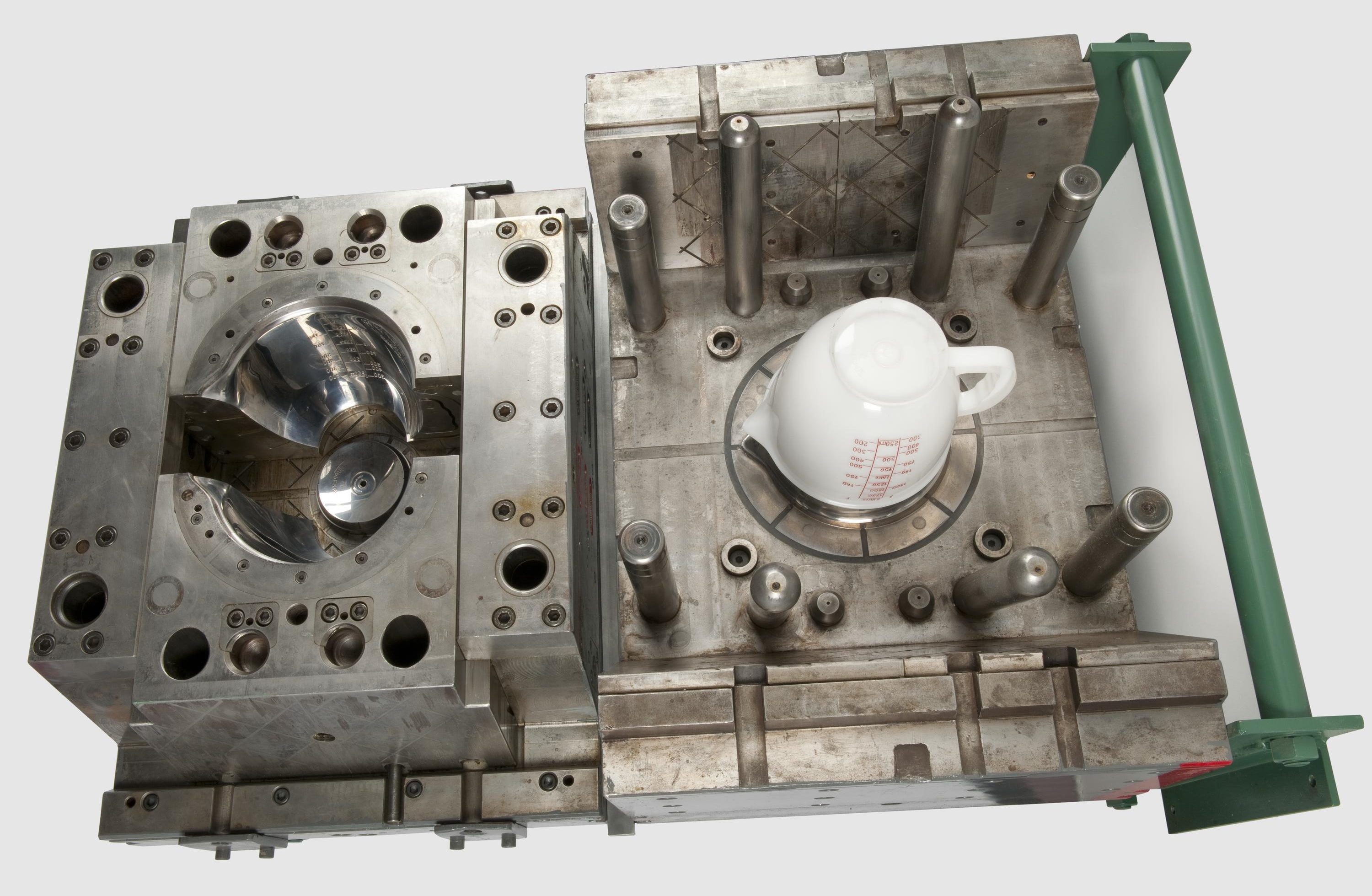 Single Impression mould used in the injection moulding of a Tupperware "Mix-n-stor" container. Late 1960s. Front 3/4 view of whole object against white background.