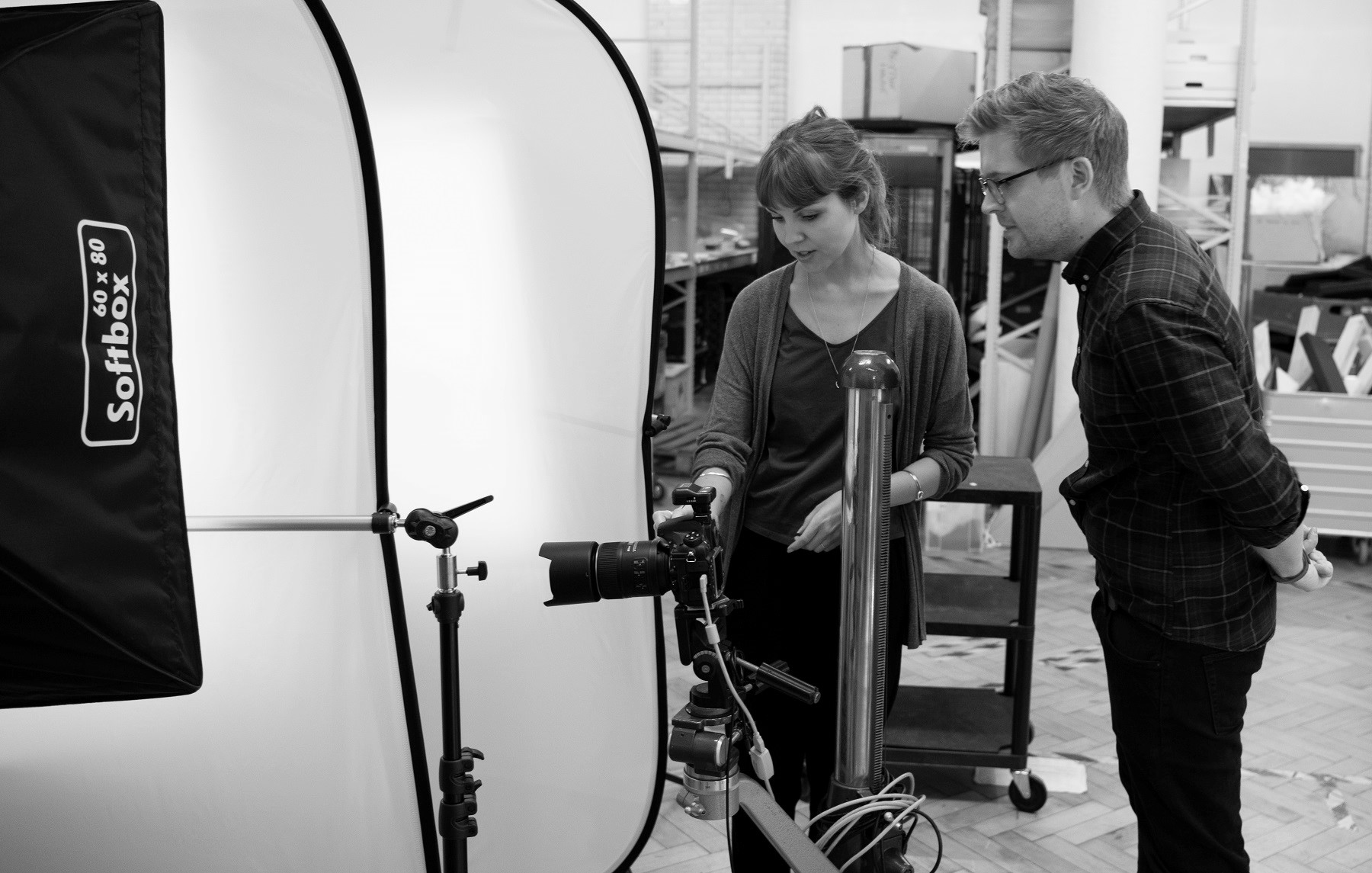 Training attendees using the turn table equipment to capture images of a collection item.