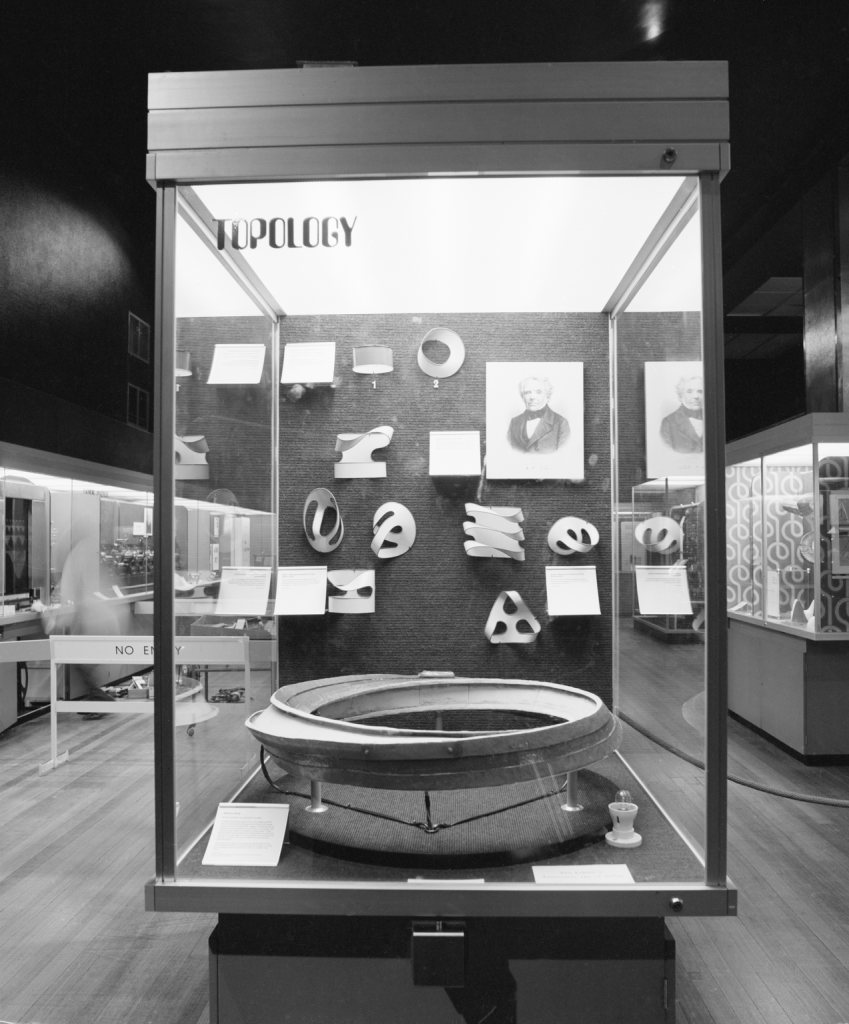 Mobius strip model with racing cars powered by a linear motor, by Eric Laithwaite, Imperial College, London, 1974