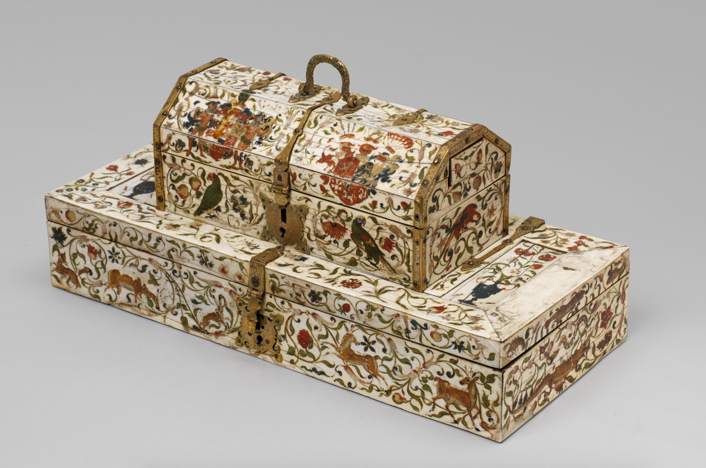 This wooden box is veneered with ivory, and closed with brass locks. There are many exotic parrots, fish, and other animals painted on the box. © The Samuel Courtauld Trust, The Courtauld Gallery, London.