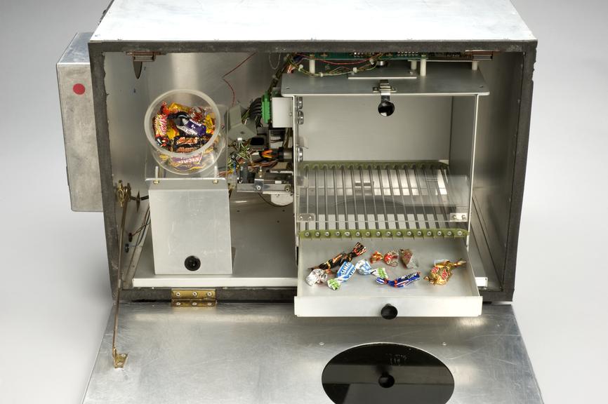 Detail view of inside of chamber to show swwet wrappers. Grey background.