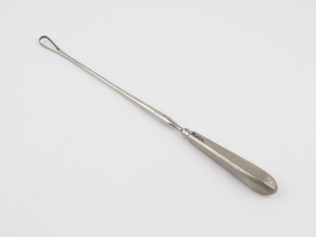 Image of a steel curette on a white background