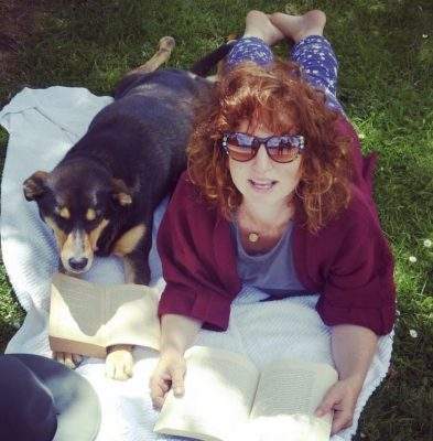 Laura and a dog lying down