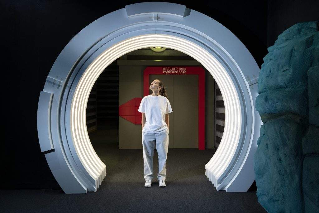 Visitors walking through the wormhole jump gate in Science Fiction Voyage to the Edge of Imagination